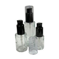 15mL (1/2 oz.) Clear Stubby Cylinder Glass Bottle with 18/415 Black Polypropylene Denali Treatment Pump with Tall Smooth Collar & Clear ABS Overcap