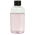 2 oz. Clear PET Cosmo High Clarity Oval Bottle with 20/410 Black Ribbed Cap with F217 Liner